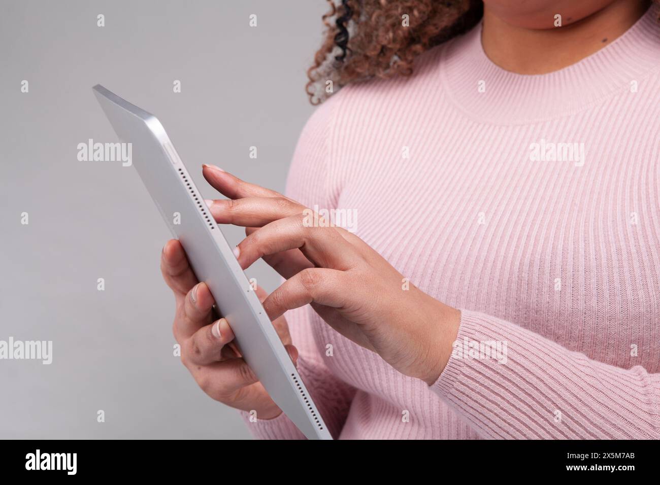 Close-up of female hands using digital tablet Stock Photo
