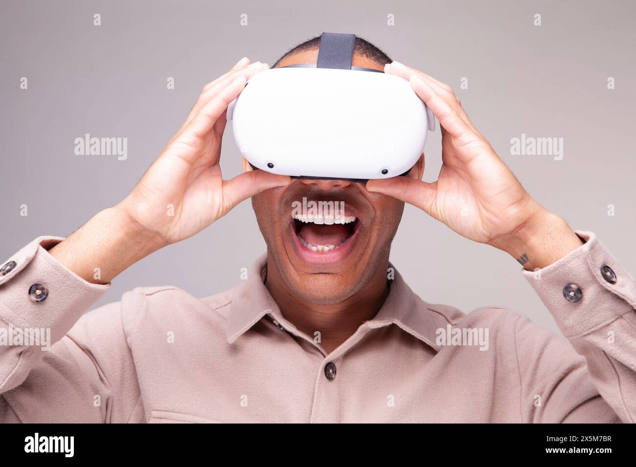 Smiling man in virtual reality headset Stock Photo