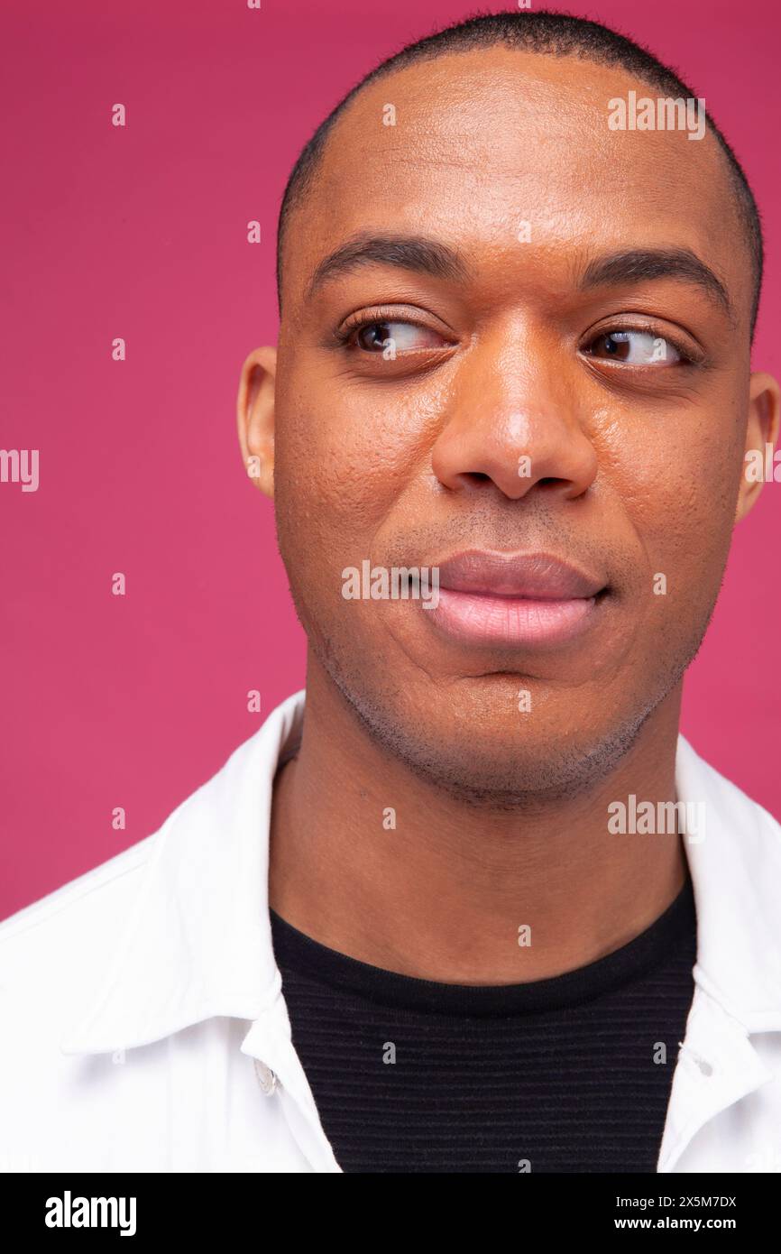 Mid adult man looking away Stock Photo
