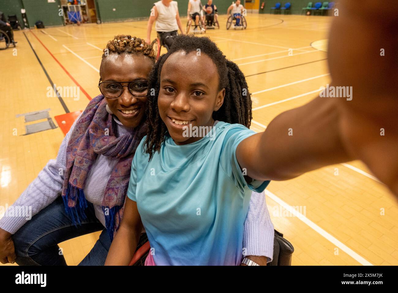 Teenage girl in wheelchair taking selfie with grandmother Stock Photo ...