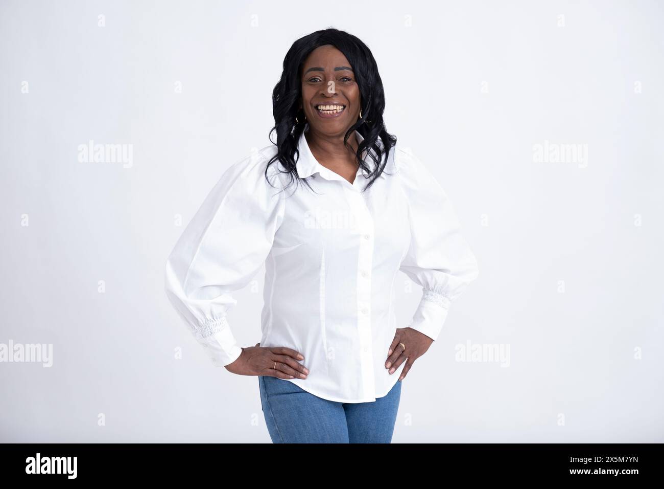 Studio portrait of mature woman wearing white shirt Stock Photo