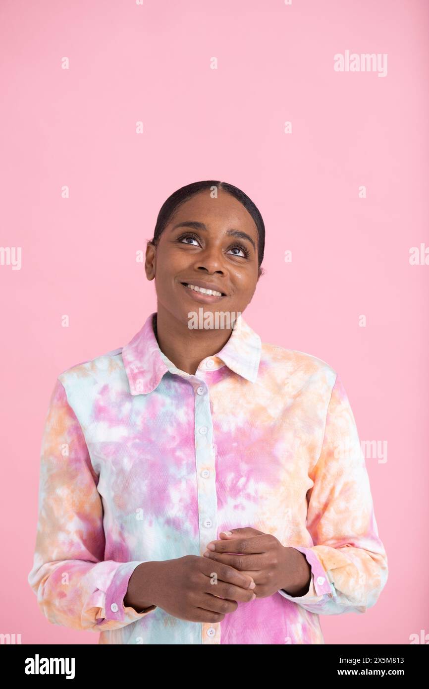 Woman wearing pink shirt hi-res stock photography and images - Alamy