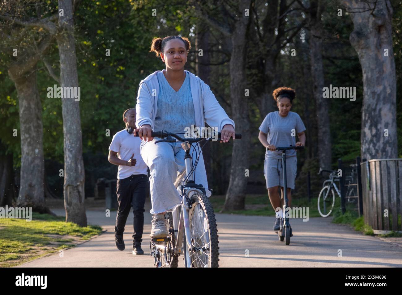 Friends doing sports in park Stock Photo