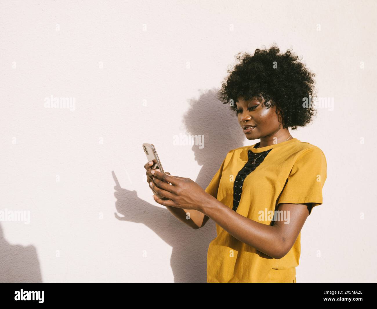 Young woman using smartphone Stock Photo