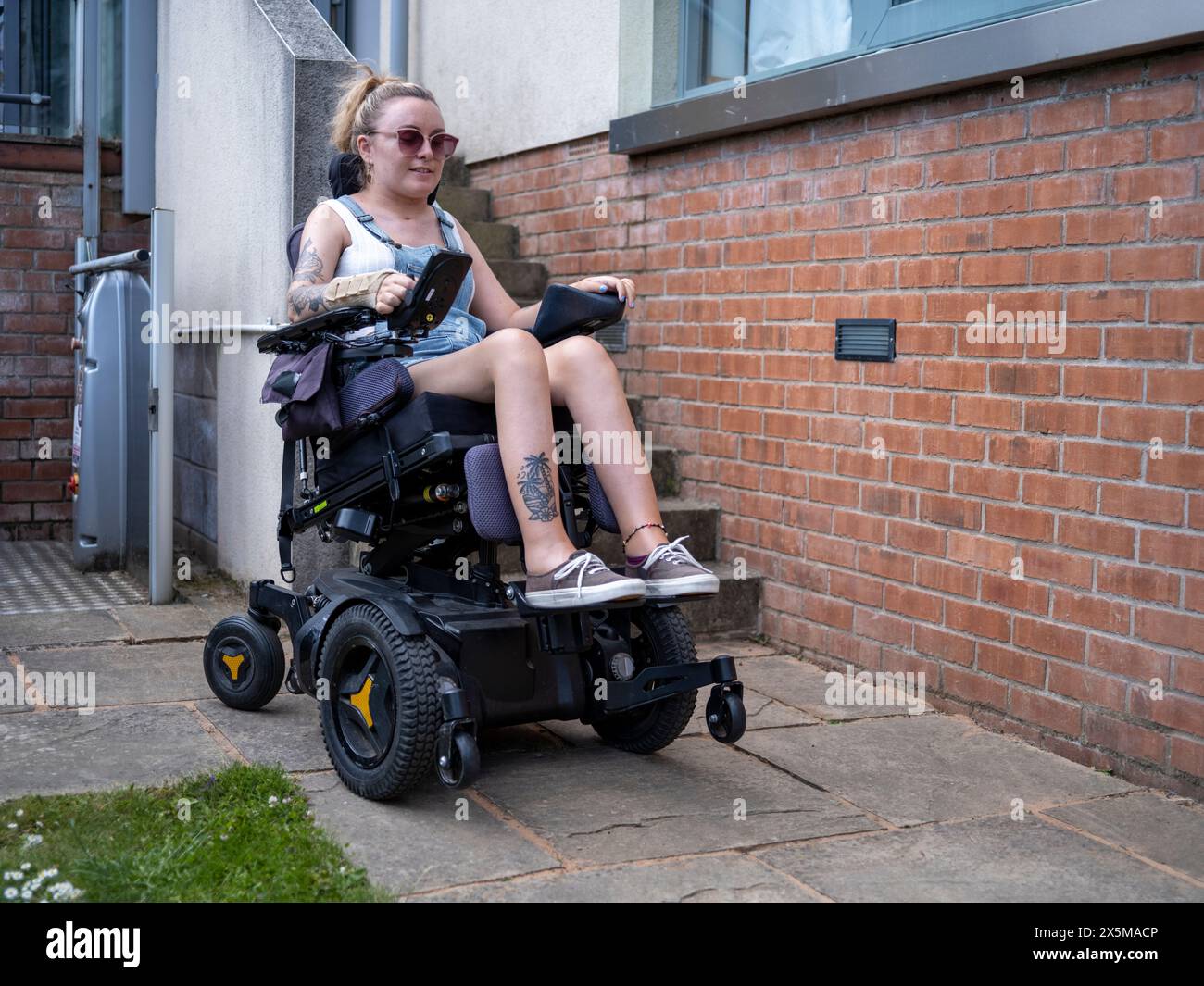 Disabled woman in electric wheelchair hi-res stock photography and images -  Alamy