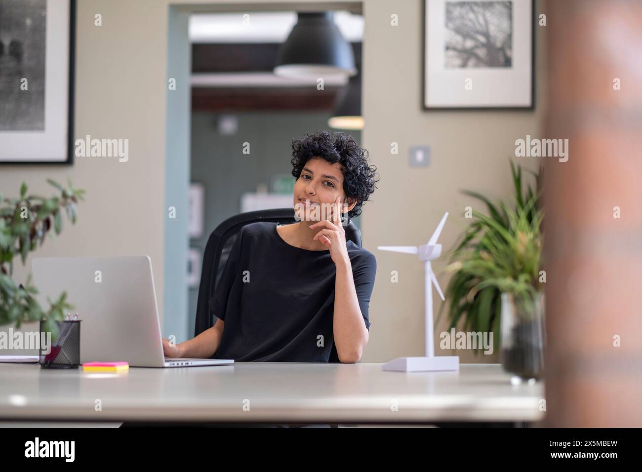 Young engineer working on laptop in office Stock Photo