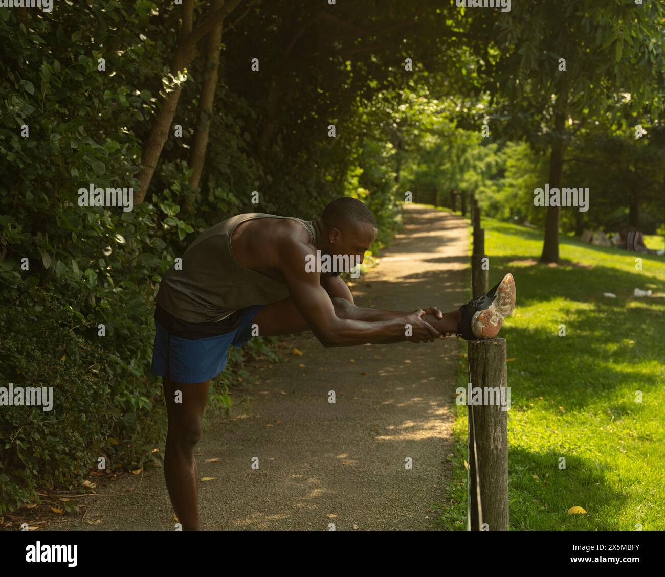 Athletic man stretching in hi-res stock photography and images - Alamy