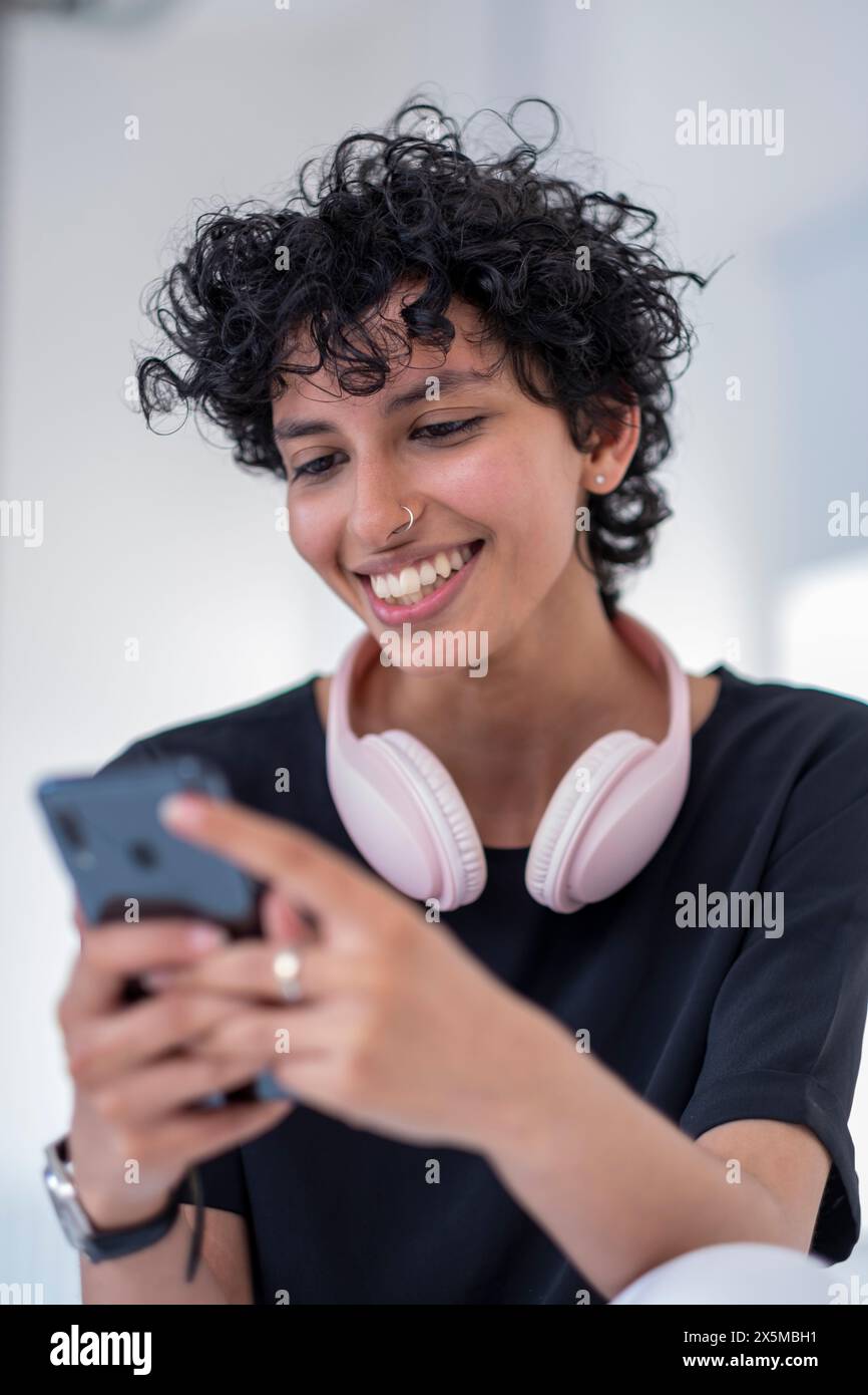 Young woman using smart phone Stock Photo