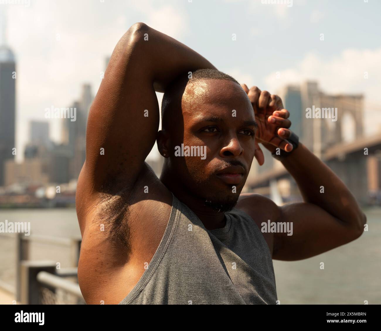 Muscular man stretching arms in hi-res stock photography and images - Alamy