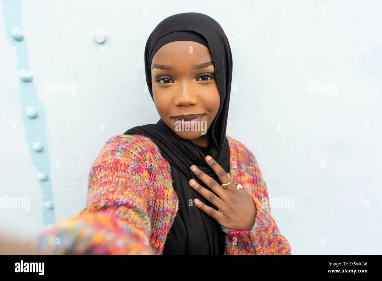 Portrait of smiling young woman wearing hijab Stock Photo