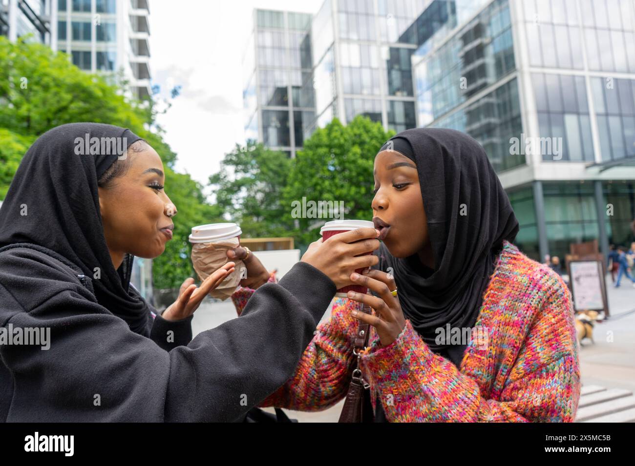 Women wearing headscarf coffee hi-res stock photography and images - Alamy