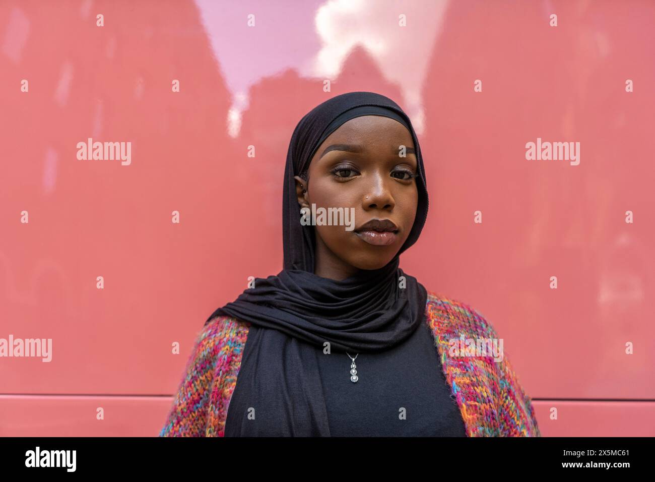 Young woman wearing pink hijab hi-res stock photography and images - Alamy