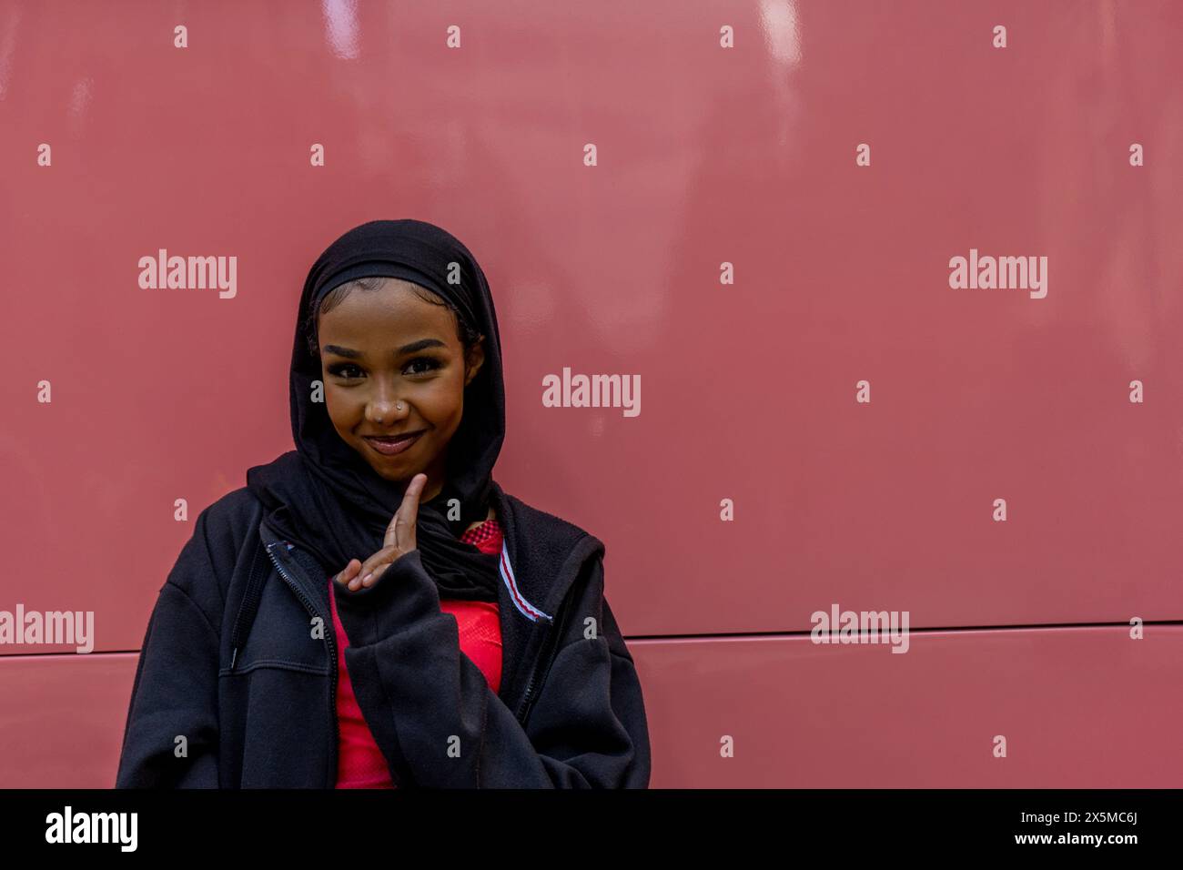 Portrait of smiling young woman wearing hijab Stock Photo