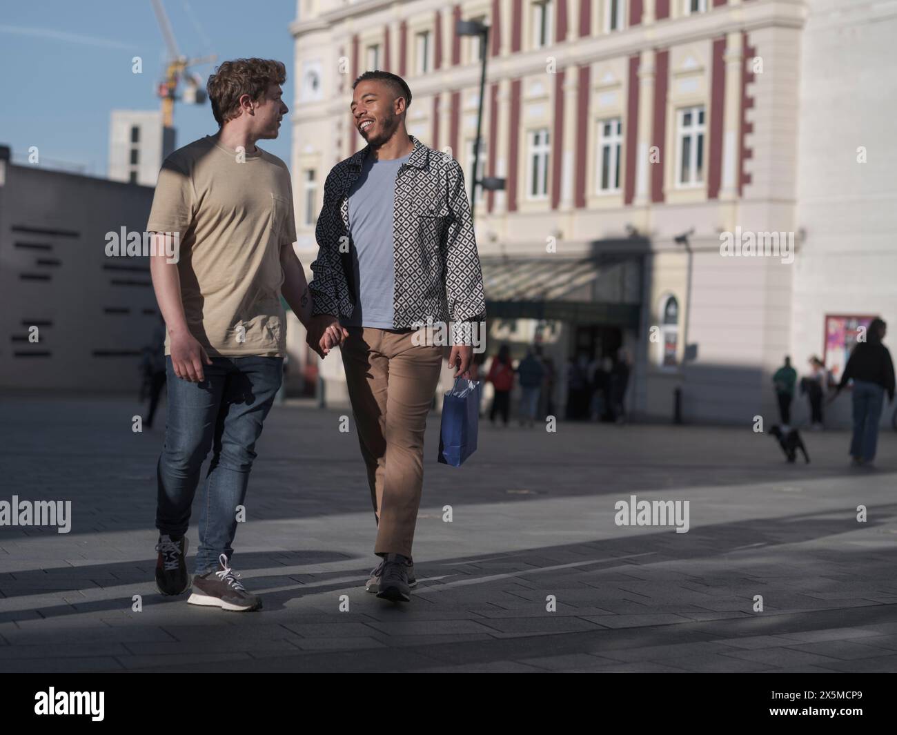 Young gay men holding hands hi-res stock photography and images - Alamy