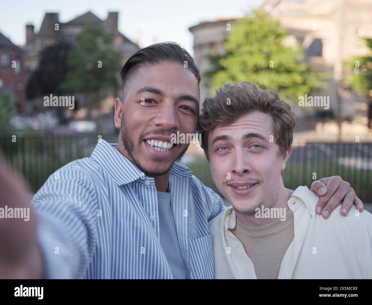 Two young gay men embracing hi-res stock photography and images - Alamy