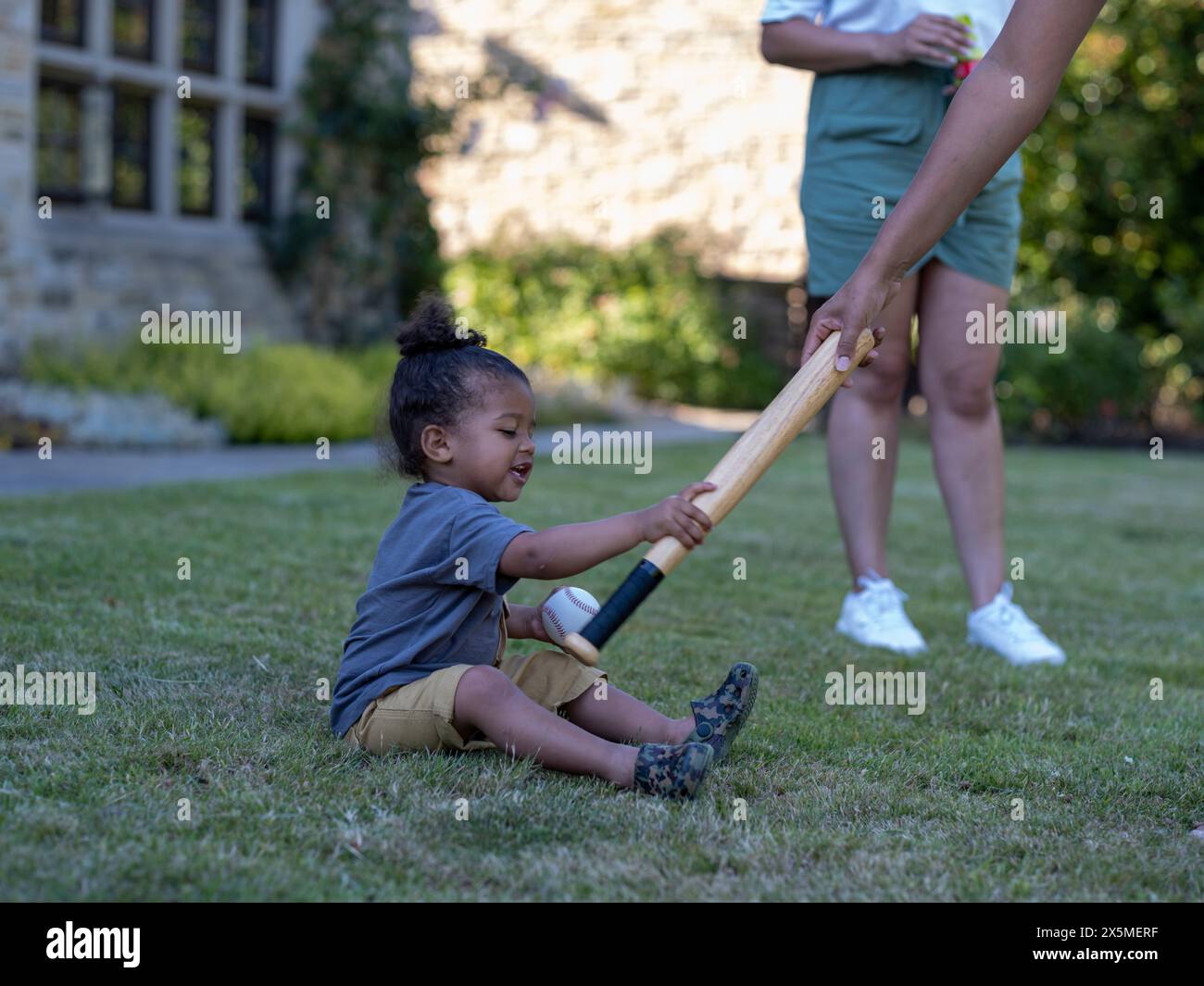 Boy (23) holding baseball bat and