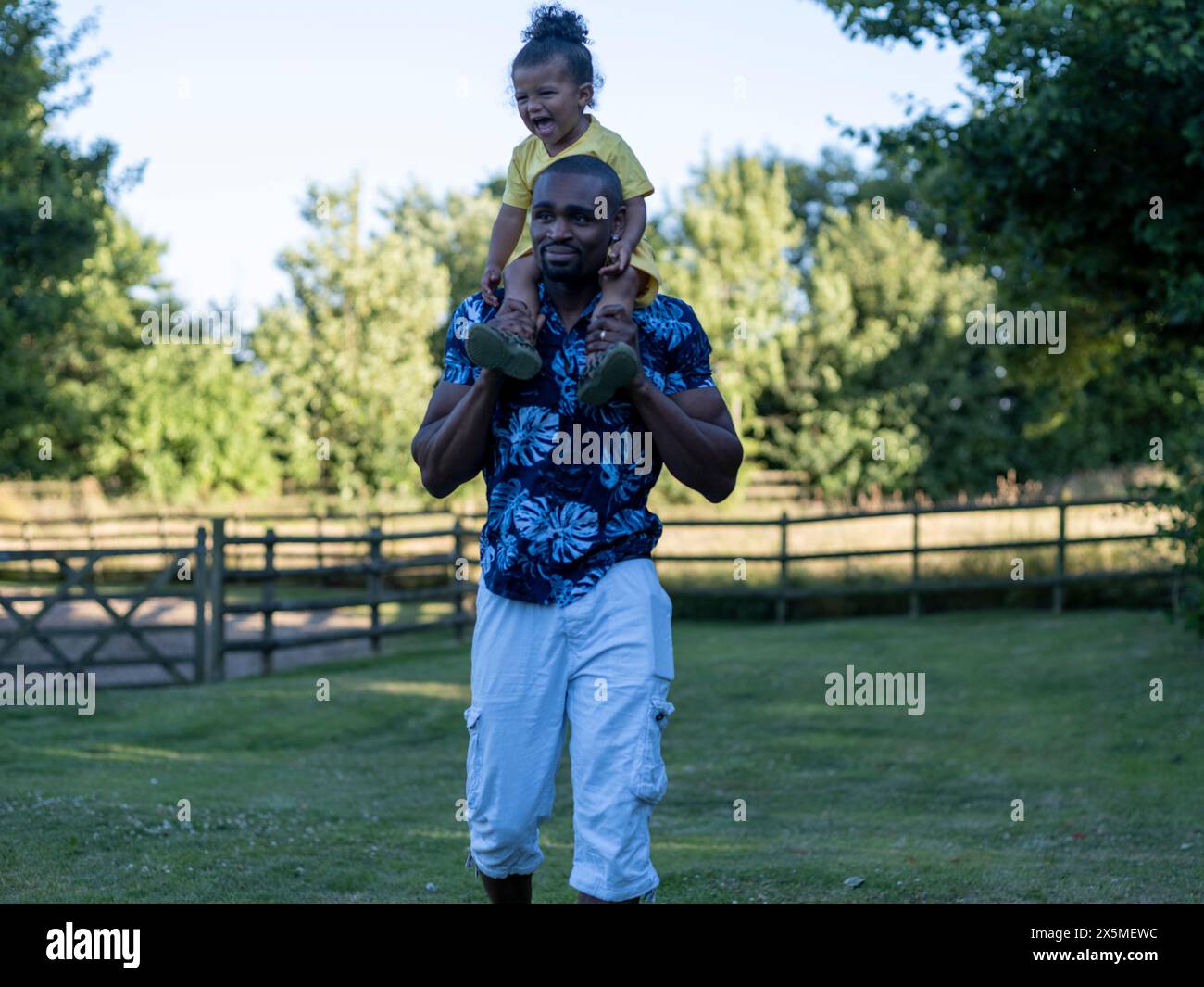 Father carrying son shoulders hi-res stock photography and images - Alamy