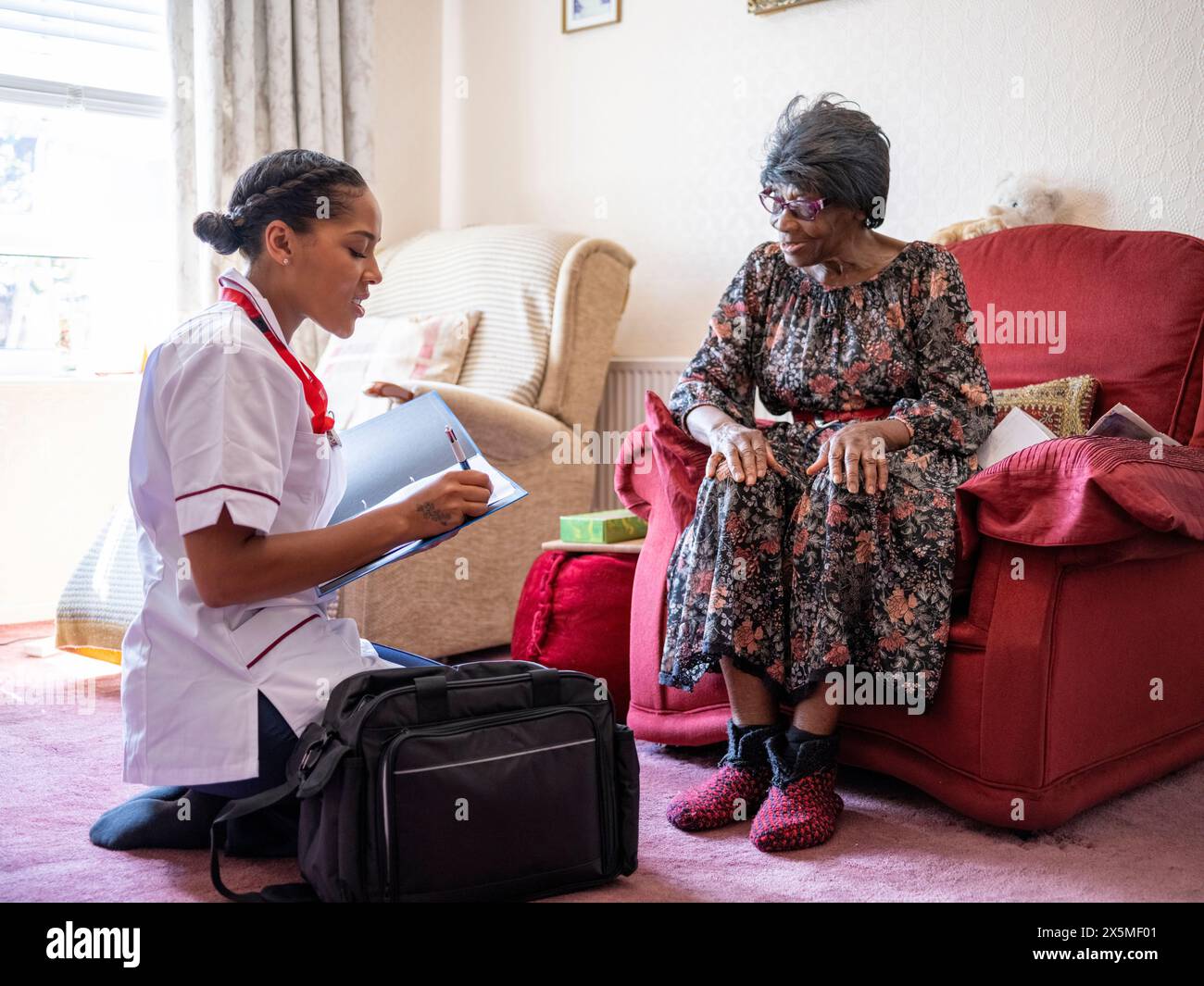 African elderly and caregiver hi-res stock photography and images - Alamy