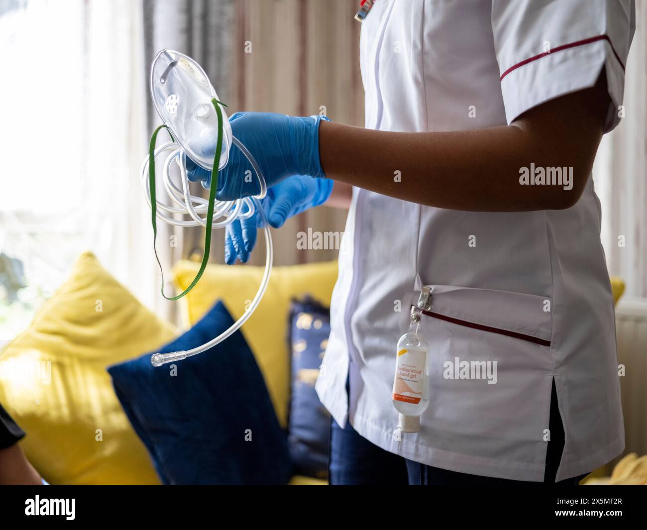 Adult holding mask hi-res stock photography and images - Alamy