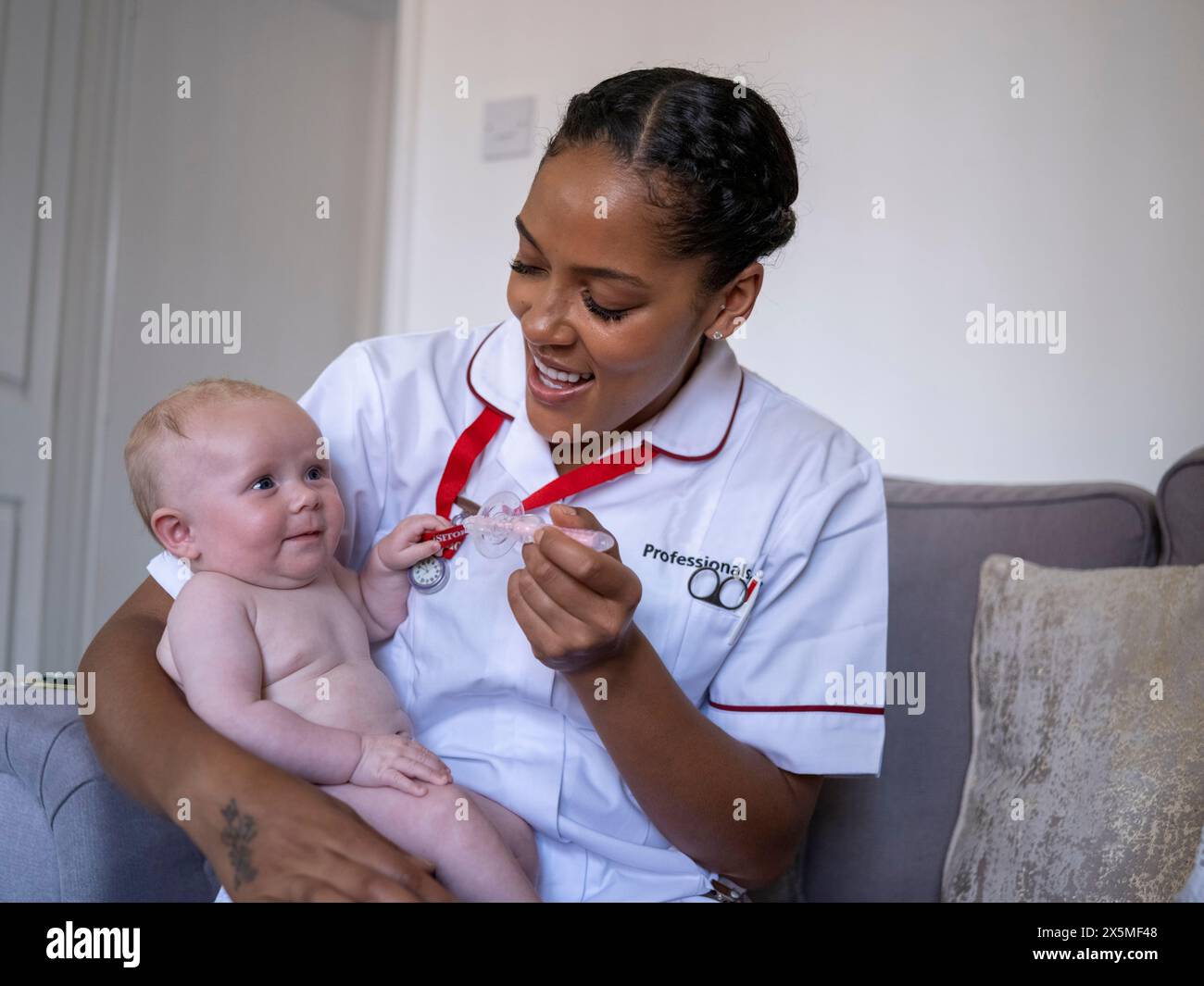 Nurse taking care baby hi-res stock photography and images - Alamy