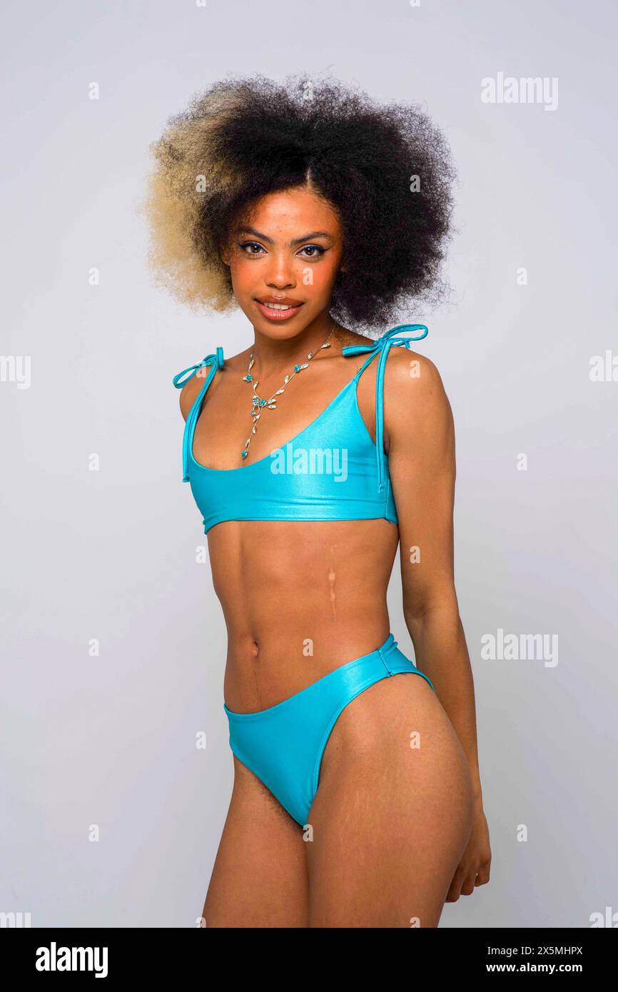 Studio portrait of woman in blue bikini Stock Photo