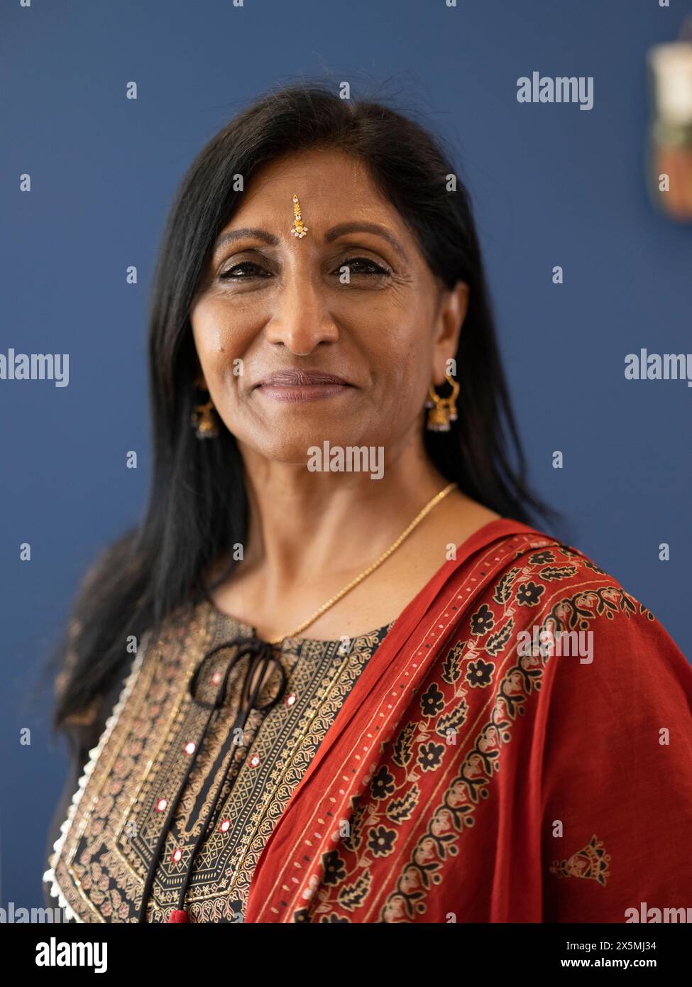 Portrait of smiling woman in traditional clothing Stock Photo - Alamy