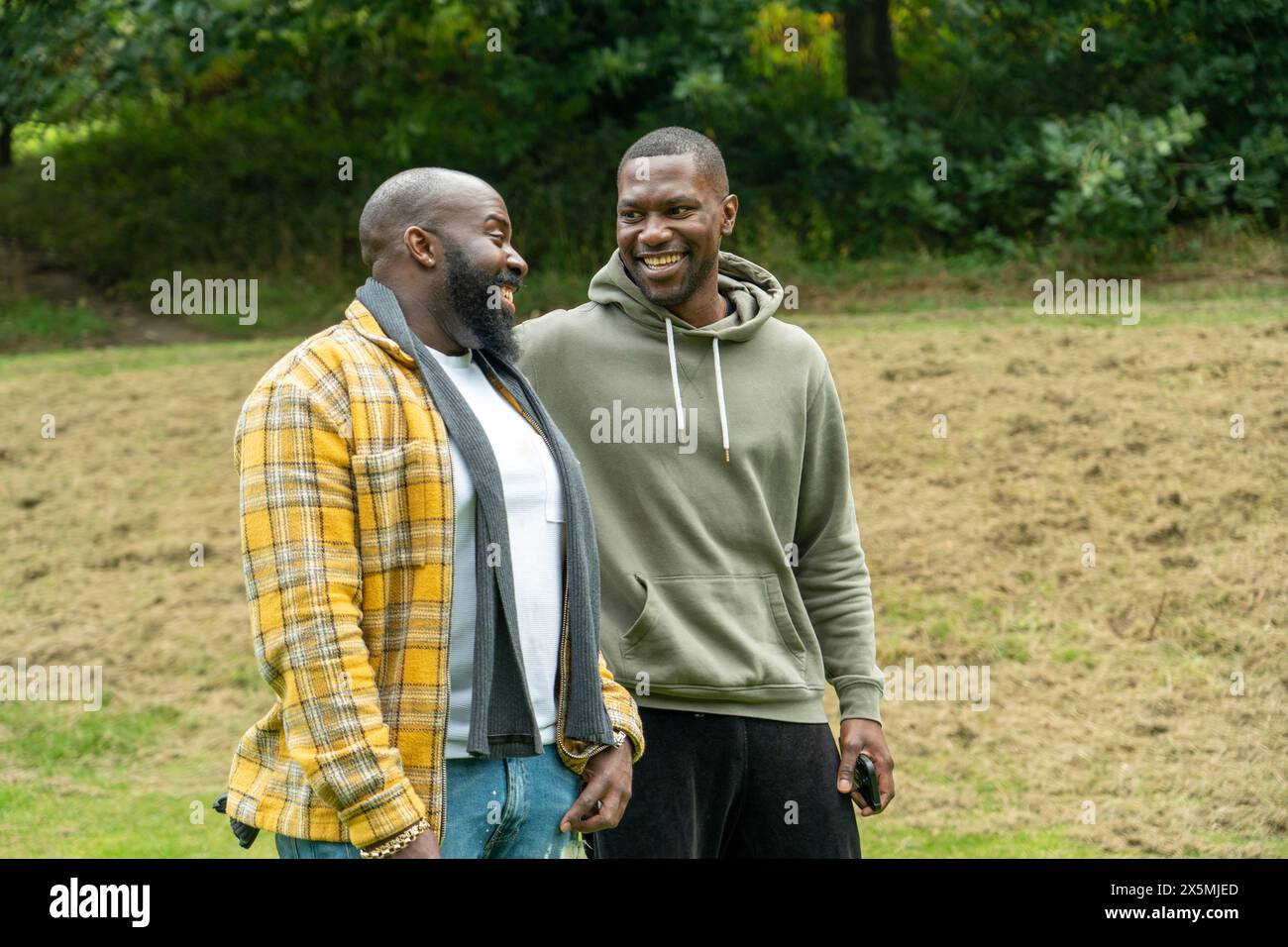 Two black men walking hi-res stock photography and images - Alamy