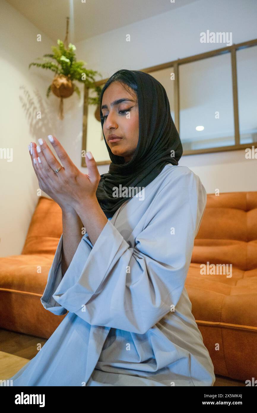 Muslim woman praying at home stock photo alamy