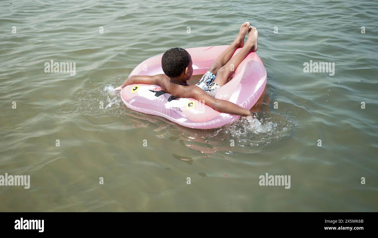 Rear view african boy hi-res stock photography and images - Alamy