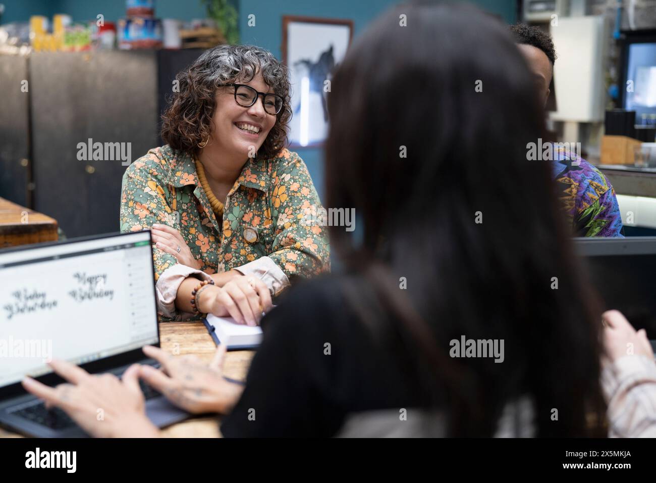 Creative professionals working together in cafeteria Stock Photo