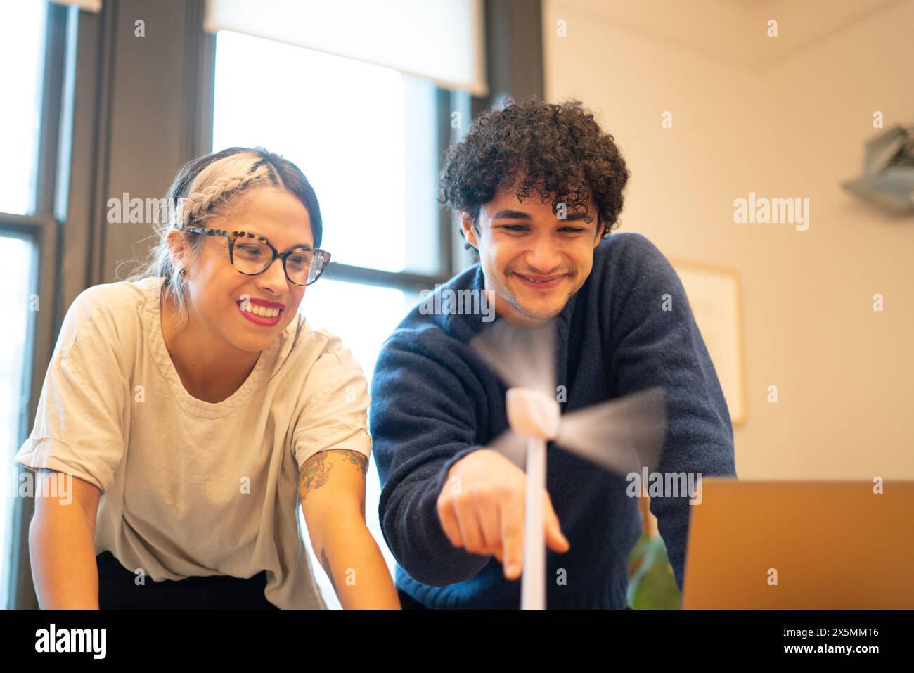 Engineers Spinning Wind Turbine Model In Office Stock Photo Alamy