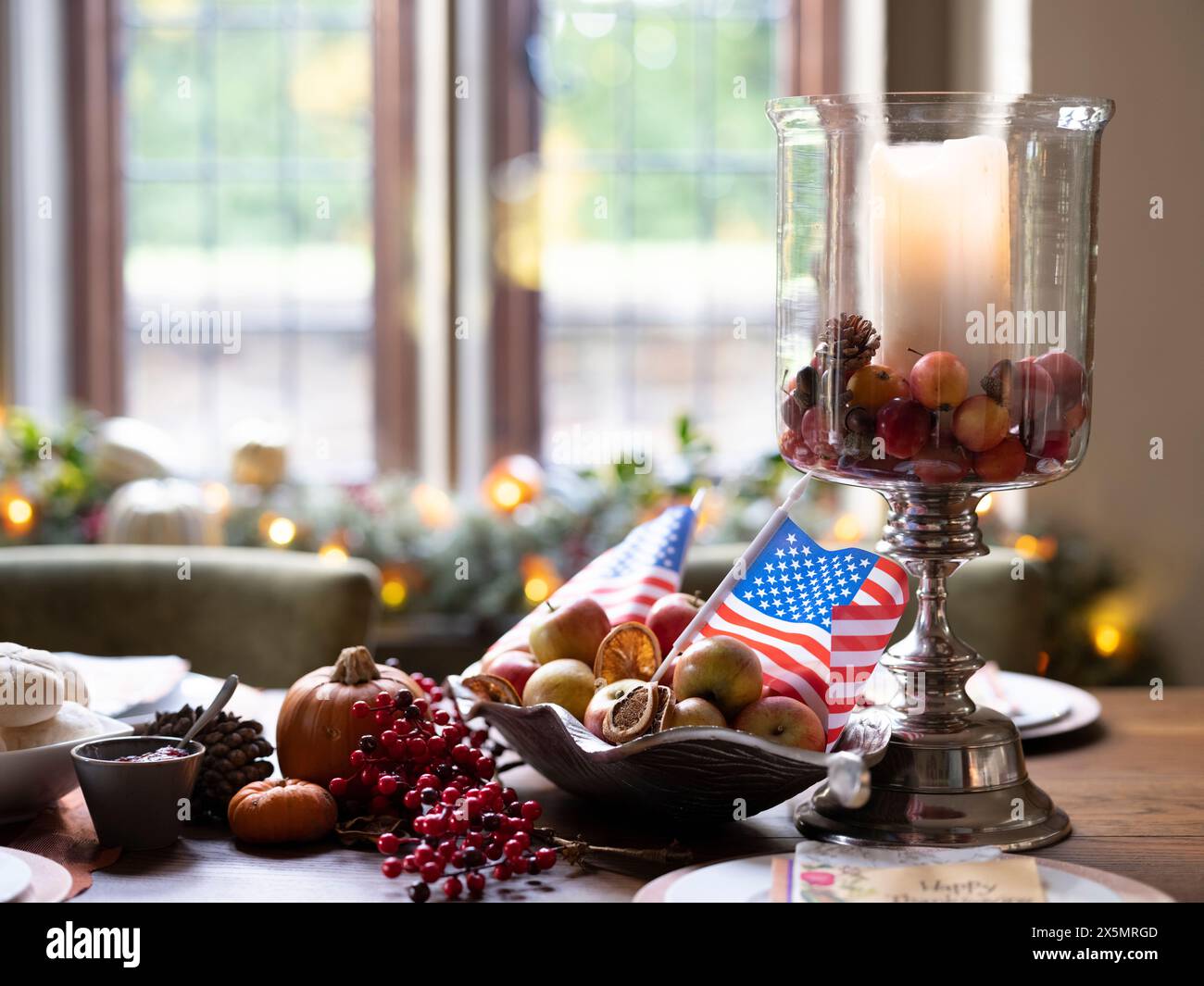 Thanksgiving decorations and American flag on table Stock Photo