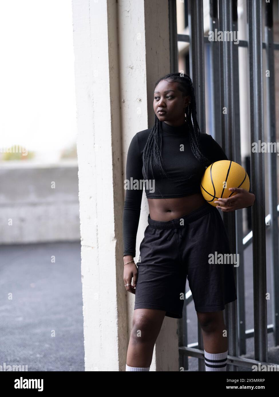 Young woman standing basketball hi-res stock photography and images - Alamy