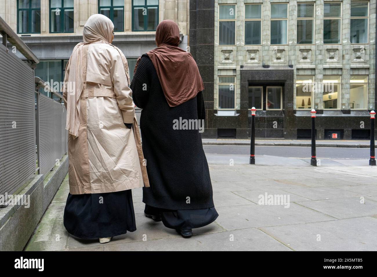 Two women walking and street hi-res stock photography and images - Alamy
