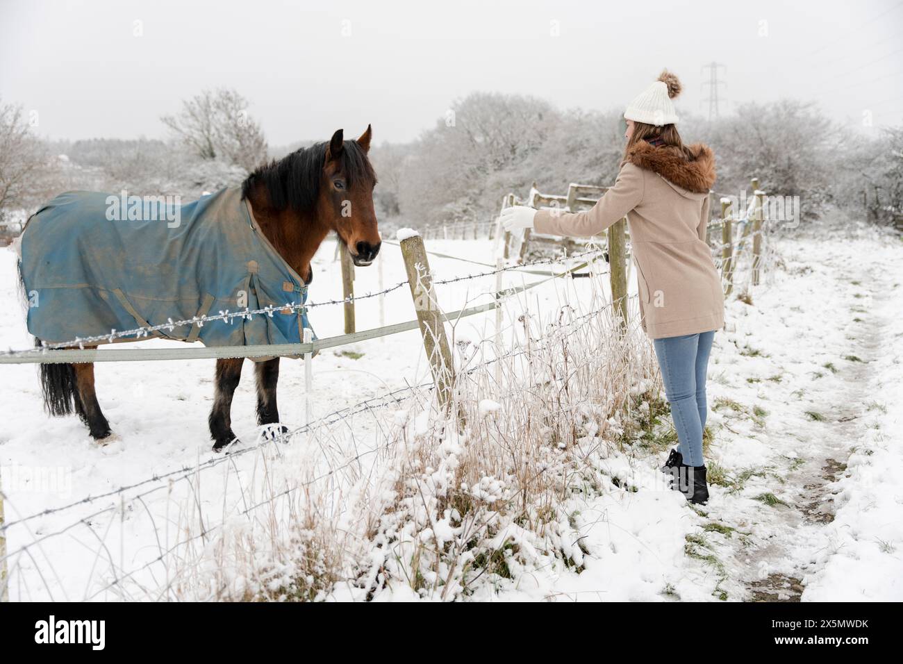 Woman in snowy landscape hi-res stock photography and images - Alamy
