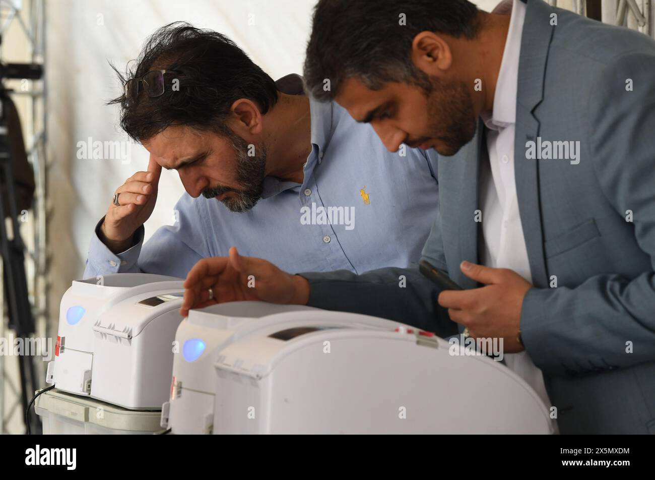 Tehran, Iran. 10th May, 2024. People vote during the second round of Iran's 12th parliamentary election in Tehran, Iran, May 10, 2024. Credit: Shadati/Xinhua/Alamy Live News Stock Photo