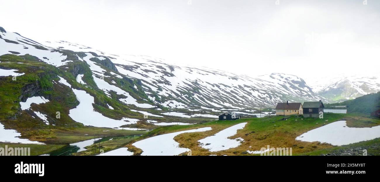 Winter nature landscape of snowcapped mountain hill covered with ice snow in Norway countryside Stock Photo