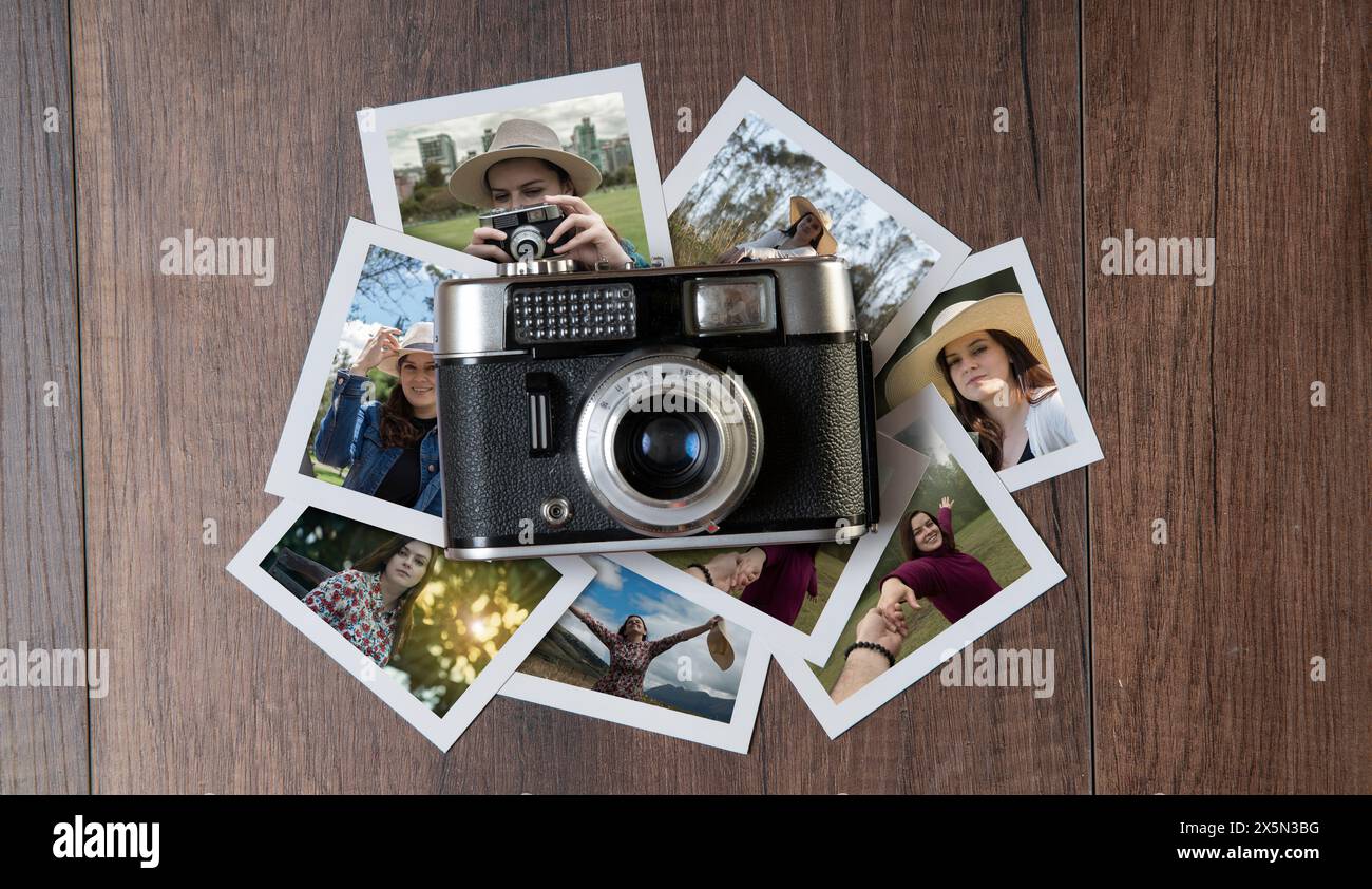Top view of Old photo camera surrounded by photographs of women in different places on a dark wooden table Stock Photo