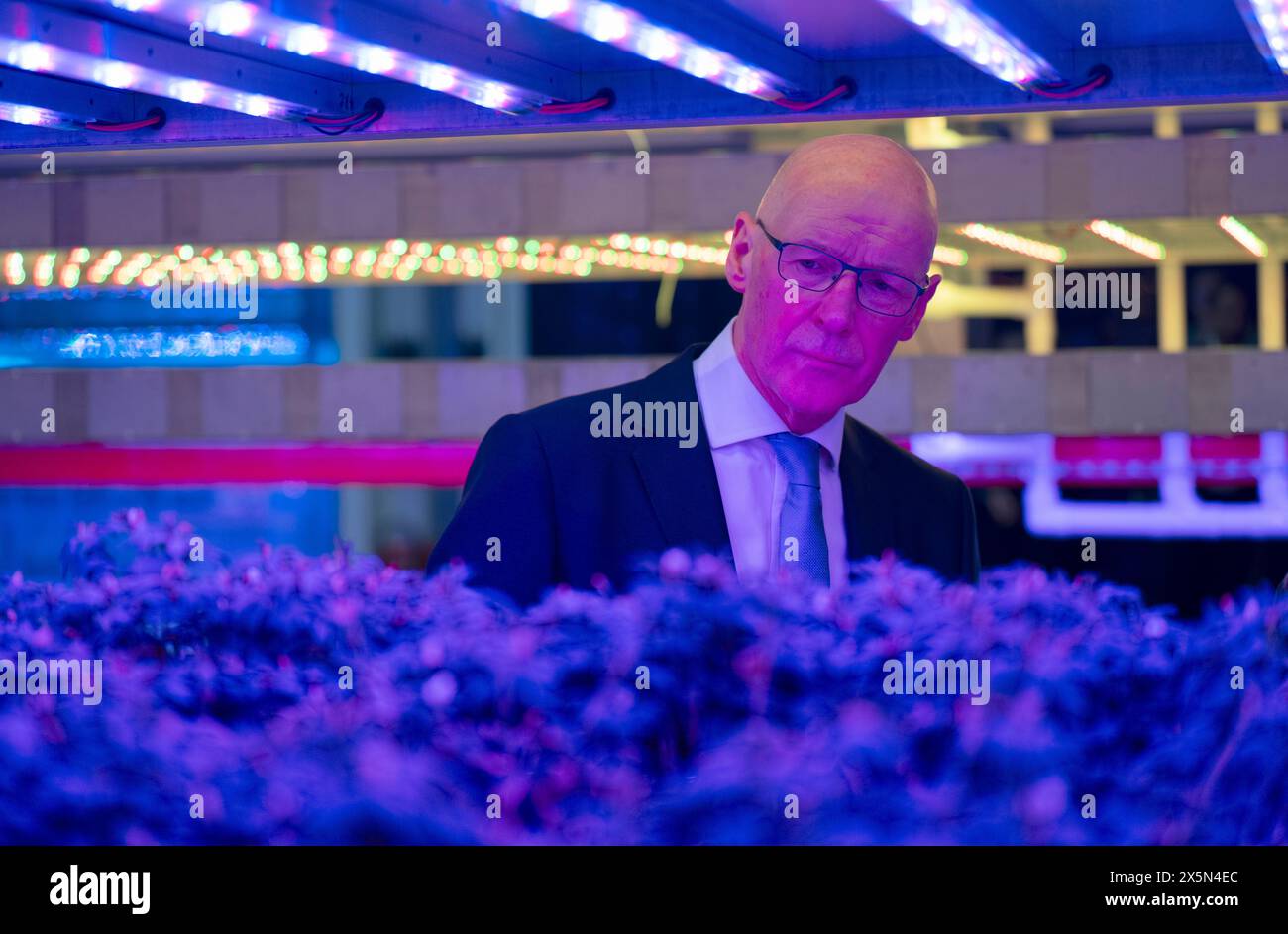 First Minister John Swinney takes a closer look at the innovative vertical farm growth towers at the Crop Research Centre, during a visit to Intelligent Growth Solutions in Dundee. Picture date: Friday May 10, 2024. Stock Photo