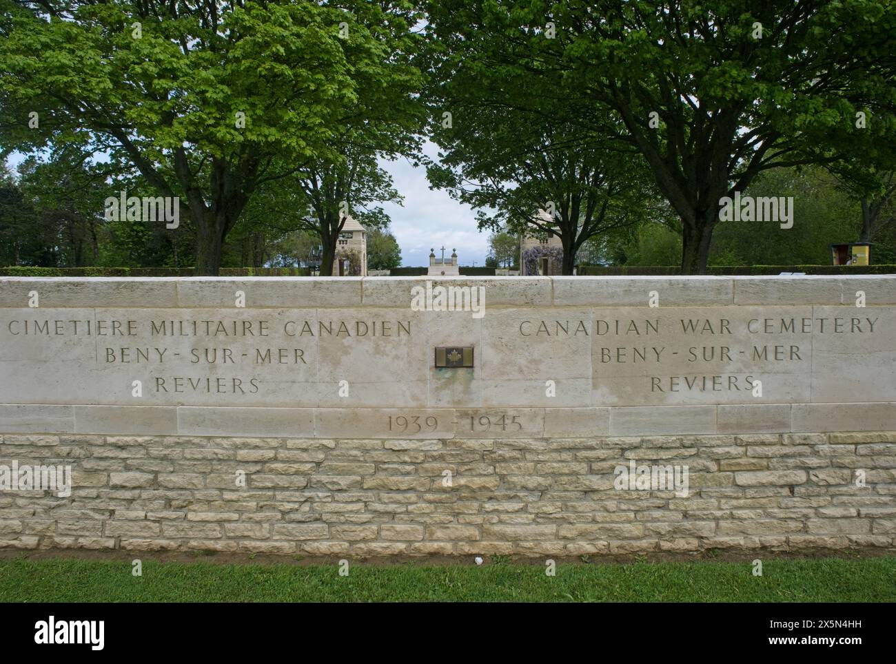 Reviers, France - May 2, 2024: This War Cemetery in Reviers contains the graves of about 2000 Commonwealth soldiers killed during Second World War. Cl Stock Photo