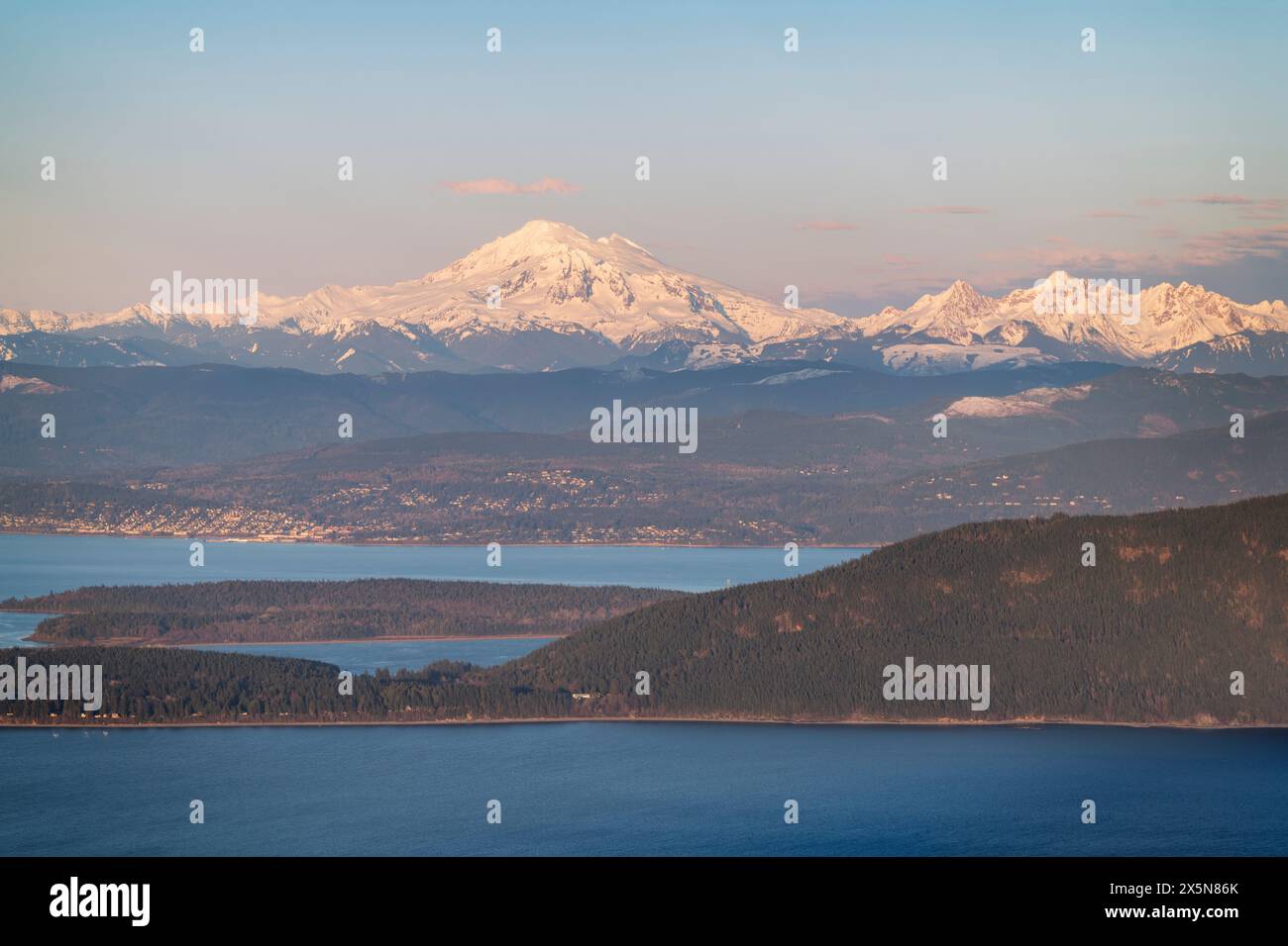 Mount Baker and Bellingham seen from summit of Mount Constitution on Orcas Island, San Juan Islands, Washington State. Stock Photo