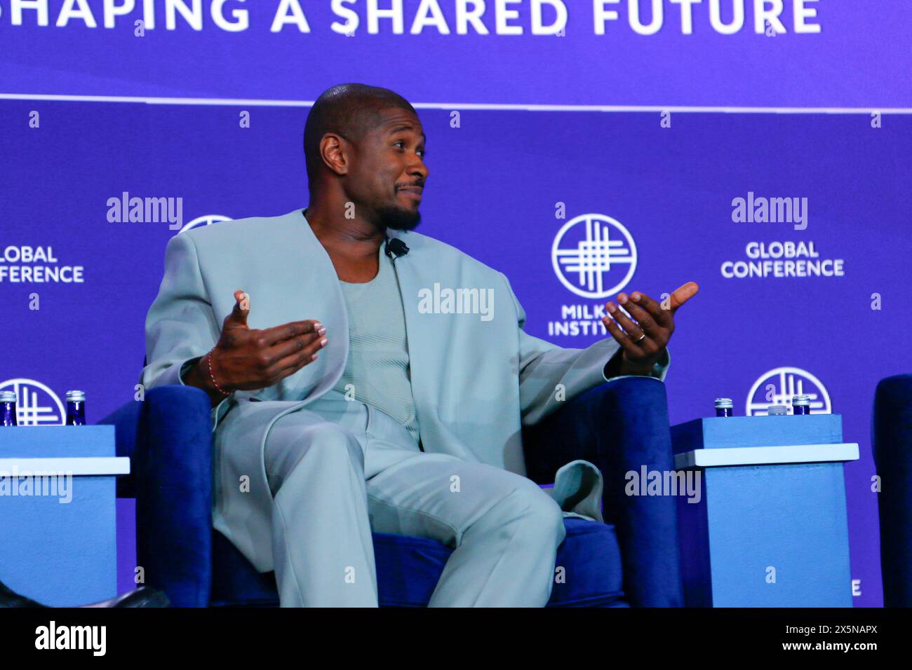 Beverly Hills, CA C May 8th, 2024 C Usher shrugs at Milken Institute