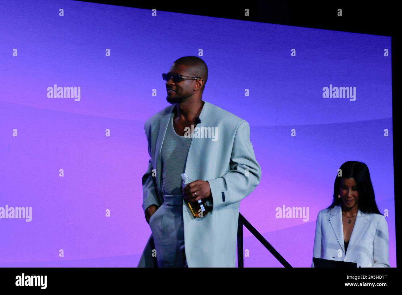 Beverly Hills, CA C May 8th, 2024 C Usher walks on stage holding a