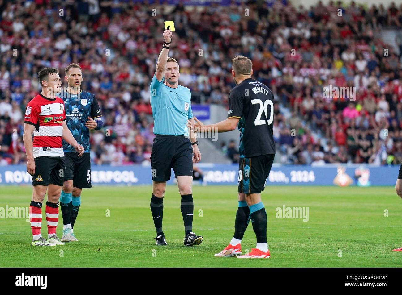 Crewe Alexandra forward Elliott Nevitt (20) booked during the Doncaster