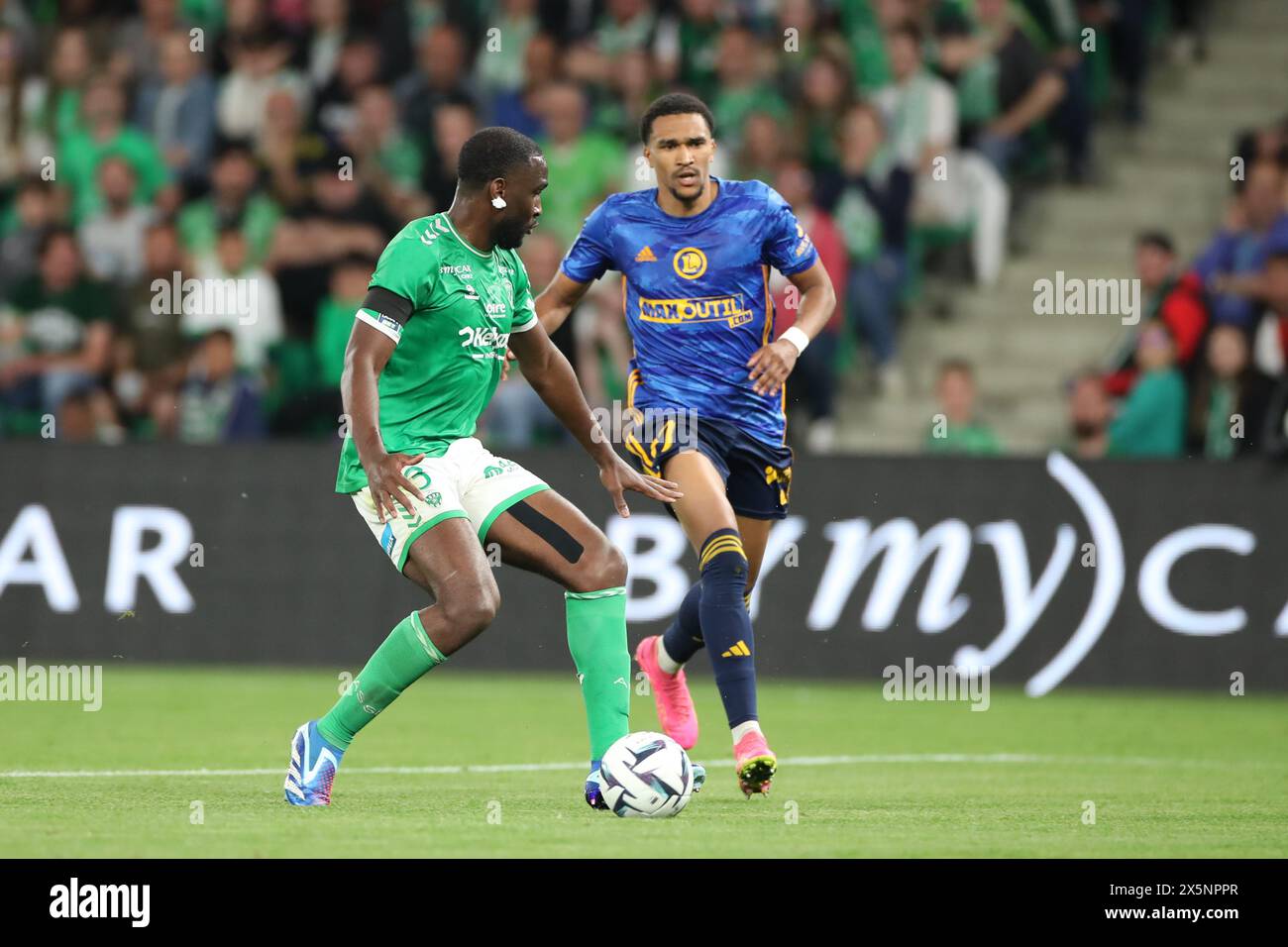 Stade Geoffroy Guichard, Saint-Etienne, France. 10th May, 2024. French League 2 football, AS Saint-Etienne versus Rodez; NADE&#xa0;Mickael plays the ball as he is pressured by HOUNTONDJI Andreas of Rodez Credit: Action Plus Sports/Alamy Live News Stock Photo