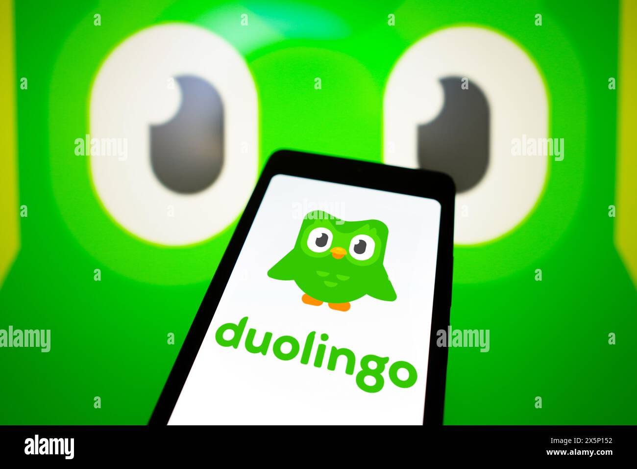 In this photo illustration, the Duolingo logo is displayed on a smartphone screen. Stock Photo