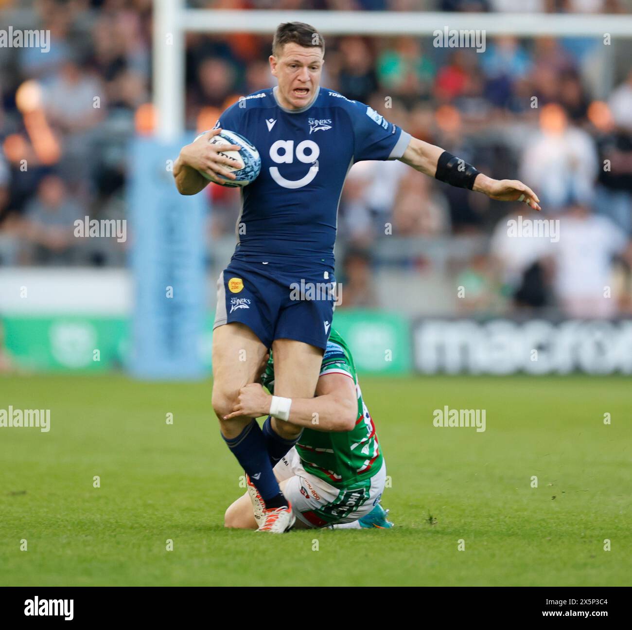 Salford, UK. 10th May, 2024. 10th May 2024; Salford Community Stadium, Salford, Lancashire, England; Gallagher Premiership Rugby, Sale Sharks versus Leicester Tigers;  Sam James of Sale Sharks is tackled on the ball Credit: Action Plus Sports Images/Alamy Live News Stock Photo