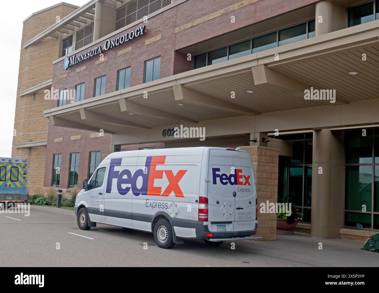 FedEx delivery truck parked at the entrance of the Minnesota Oncology building an affiliate of The Mayo Clinic. Woodbury Minnesota MN USA Stock Photo