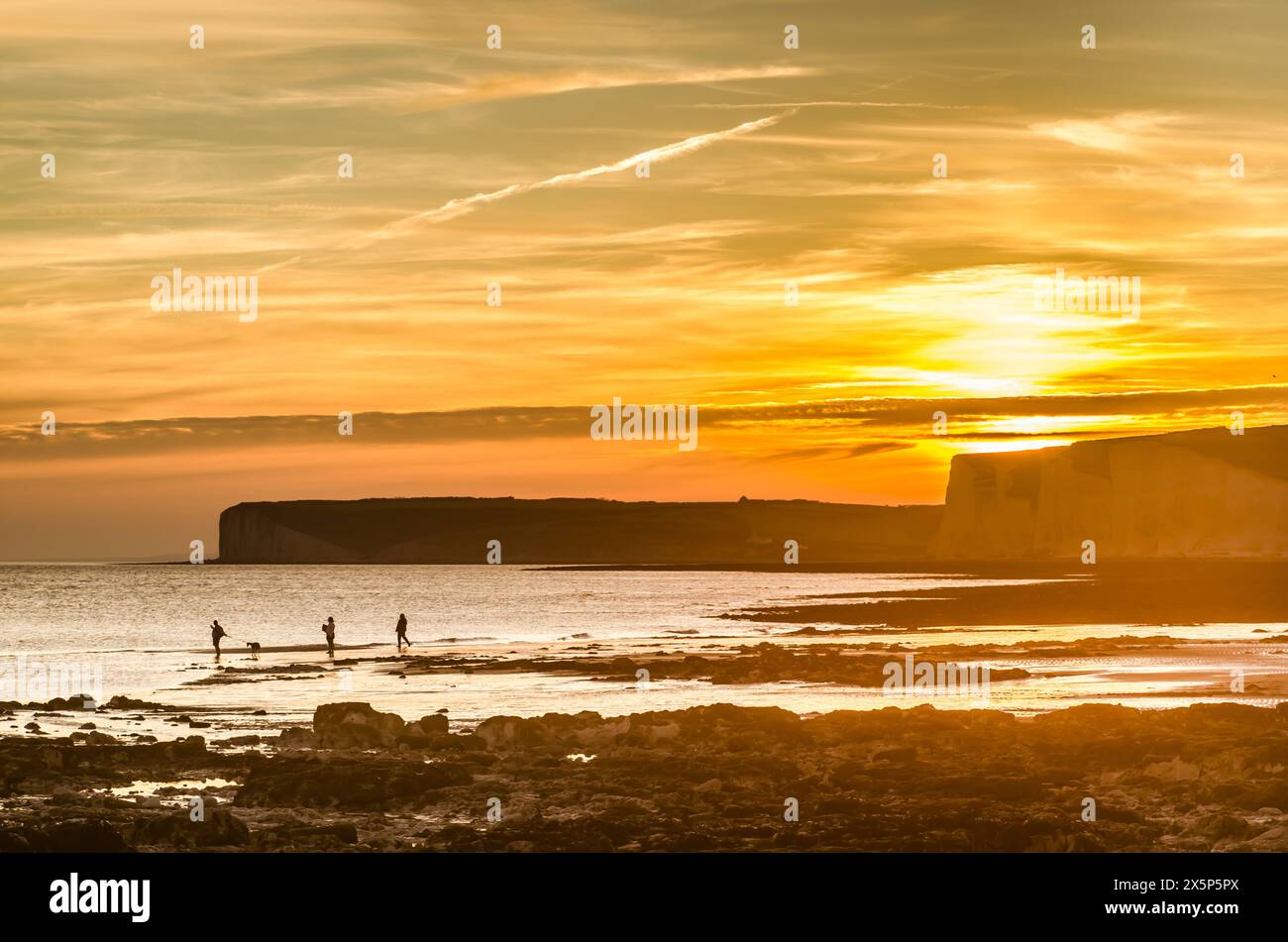 Birling Gap, Eastbourne, East Sussex, UK. 10th May, 2024. End of another glorious warm day on the South Coast as the sun dips beyond the Seven Sisters cliffs creating spectacular colours in the cloudy sky. Credit: David Burr/Alamy Live News Stock Photo
