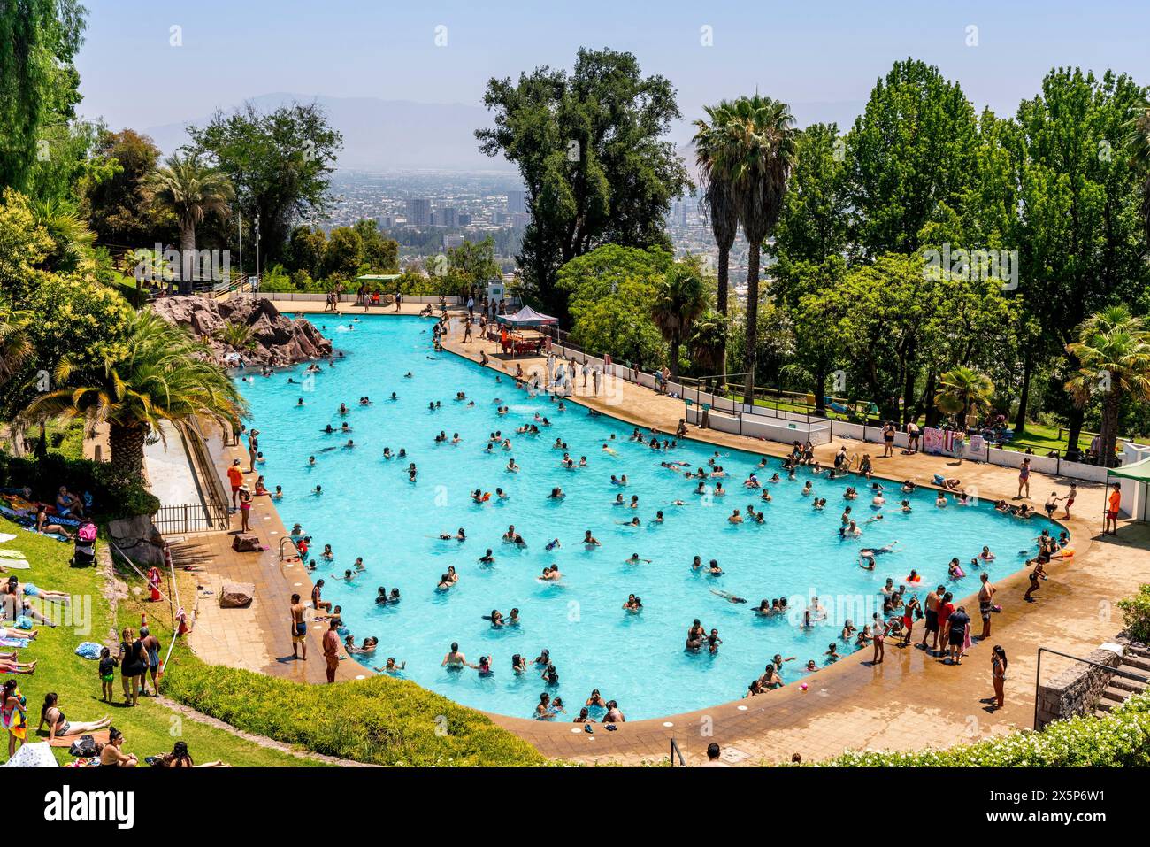 Local People Enjoying The Outdoor Swimming Pool At The Top of Cerro San Cristobal, Santiago, Chile. Stock Photo